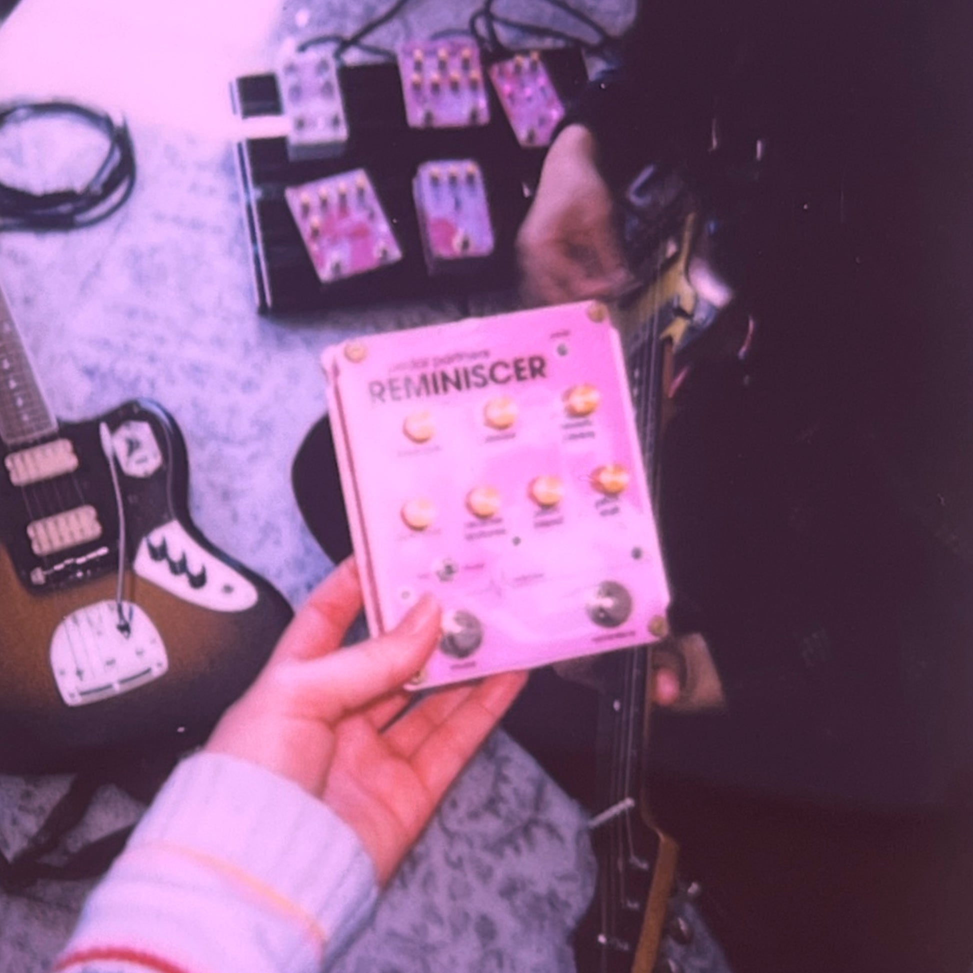 reminiscer guitar pedal pictured in a music studio with effects pedals & dream pop pedalboards